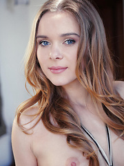 Effortlessly seductive, Kaite fulfills every man's desire of finding a smoking hot babe, undressing her lingerie on top of their otherwise vacant bed.