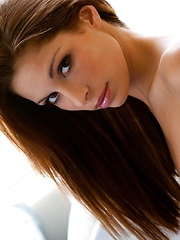 Cayton Caley - lies in bed against the soft sheets