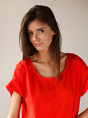 Sunshine A posing naked in her red hot stiletto heels.