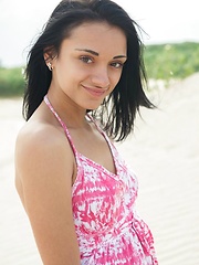 Amidst the the sea glaring brightly   from the midnoon sun, Aprilia entices   us with an appetizing display of her   body\'s scrumptious assets, and frolics   among the sandy beach, uninhibited and   carefree.