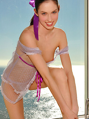 Tempting Guinevere in see through lavander lingerie spreading her legs exposing her pretty, shaved pussy